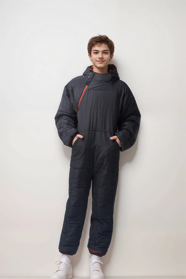 Boy in terracotta Selk' bag sleeping bag suit.