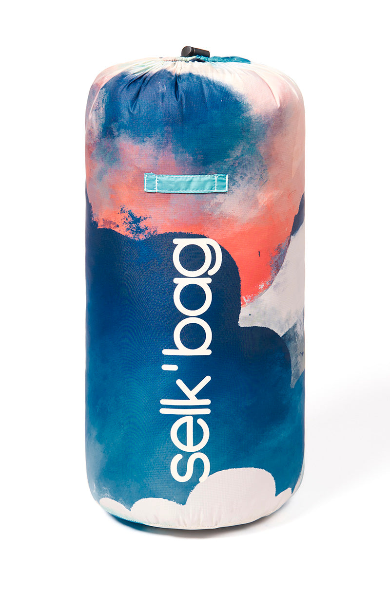 Sleeping bag blanket with colourful clouds rolled up