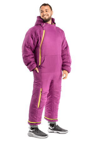 Adult man wearing a purple Selk'bag sleeping bag onesie
