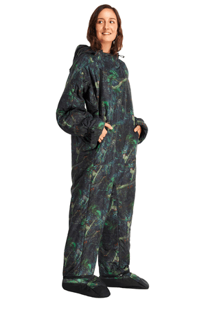 Adult woman wearing a Selk'bag Rainforest sleeping bag onesie