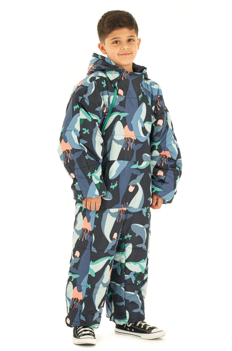 Adult man wearing a Selk'bag Pursuit Realtree® EDGE® camouflage sleeping bag suit