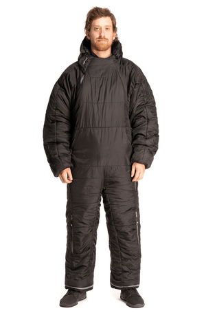 Adult man wearing a Selk'bag sleeping bag suit in black