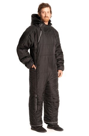 Adult man in a Selk'bag wearable sleeping bag in black