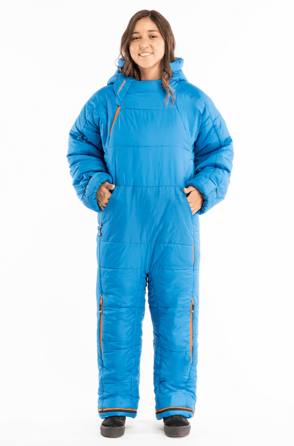 Adult woman wearing a Selk'bag sleeping bag suit in blue