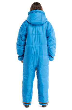 Adult womain wearing a Selk'bag full body sleeping bag in blue