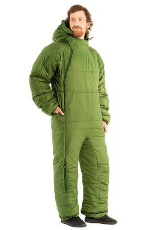 Adult man in a green Selk'bag wearable sleeping bag