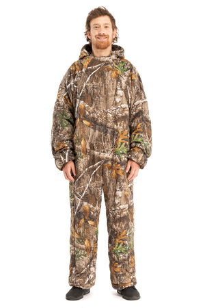 Adult man wearing a Selk'bag Pursit1 Realtree® EDGE® camouflage sleeping bag suit