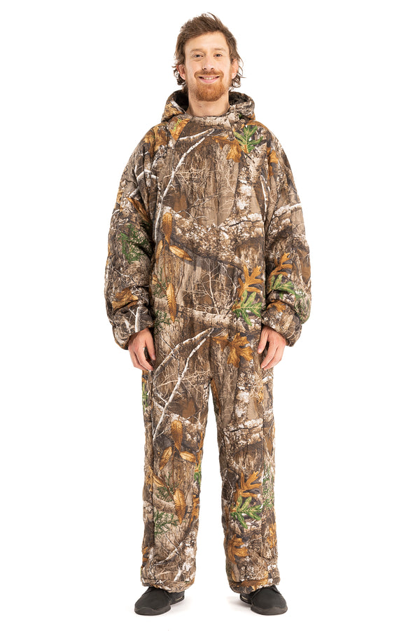 Adult man wearing a Selk'bag Pursit1 Realtree® EDGE® camouflage sleeping bag suit