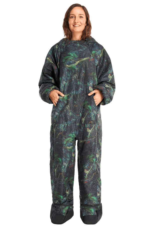 An adult woman wearing a Selk'bag Rainforest sleeping bag suit