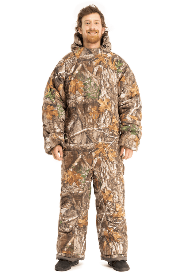 Adult man wearing a Selk'bag Instinct Realtree® EDGE® camouflage sleeping bag suit
