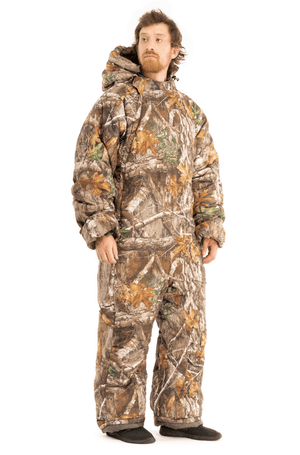 Adult man wearing a Selk'bag Instinct Realtree® EDGE® camouflage sleeping bag onesie