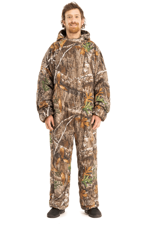 Adult man wearing a Selk'bag Pursuit Realtree® EDGE® camouflage sleeping bag suit